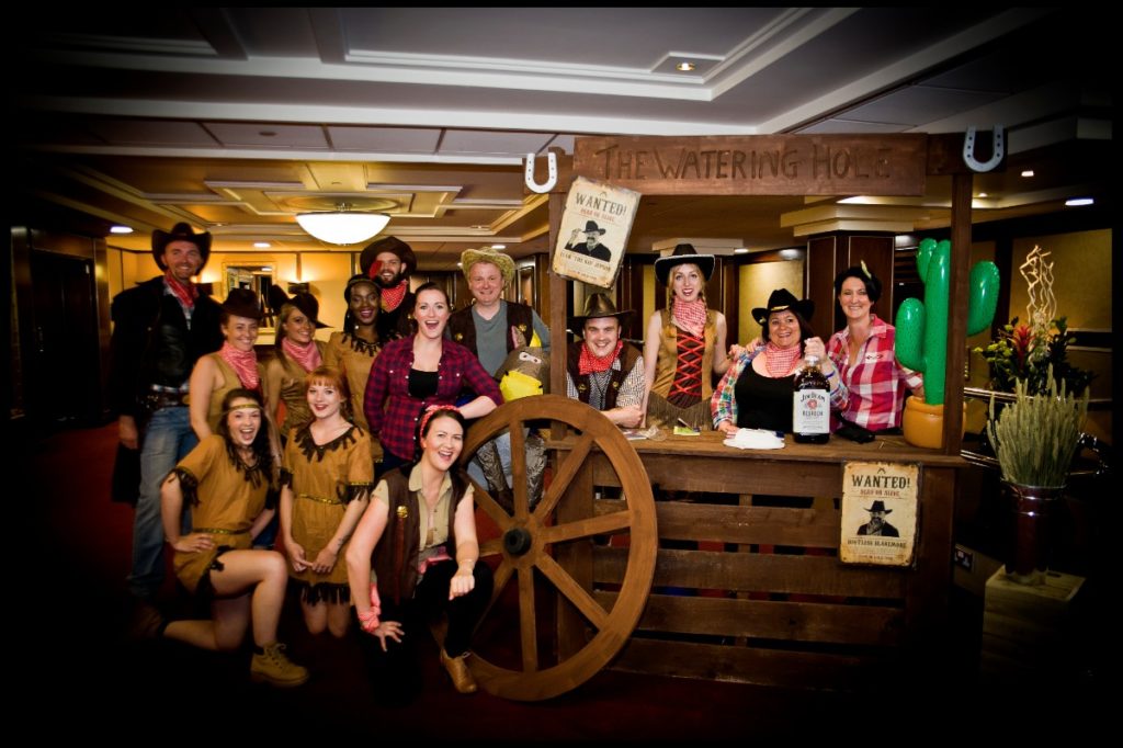 Wild West Charity Hoedown wooden stalls wagon wheel table centres