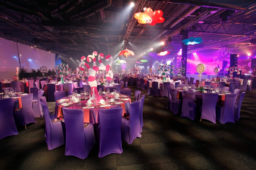 Willy Wonka Theme gala dinner striped tree table centres purple and red