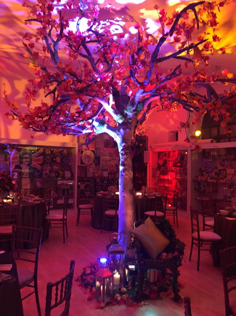 large fake artificial maple tree lanterns at bases with light going up the tree