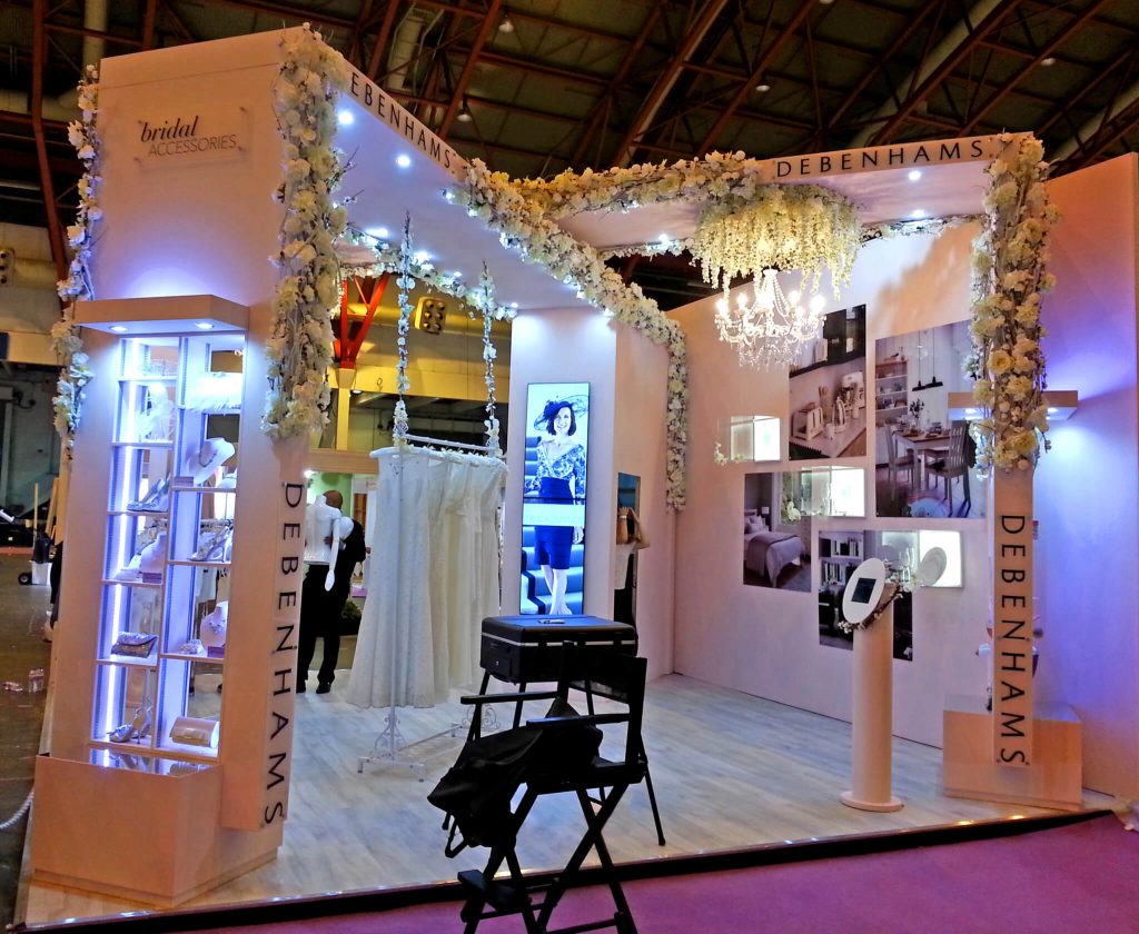 Show stand with flowers and foliage on ceiling and above stands