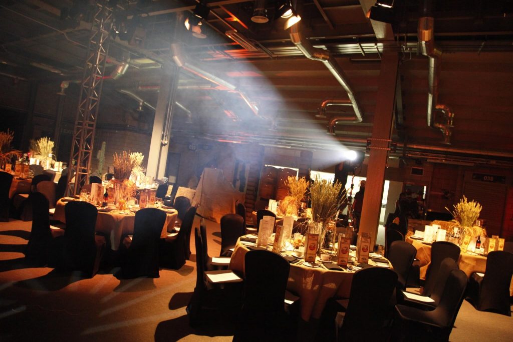 wild west gala dinner black chair covers hay bales wheat bucket table centres