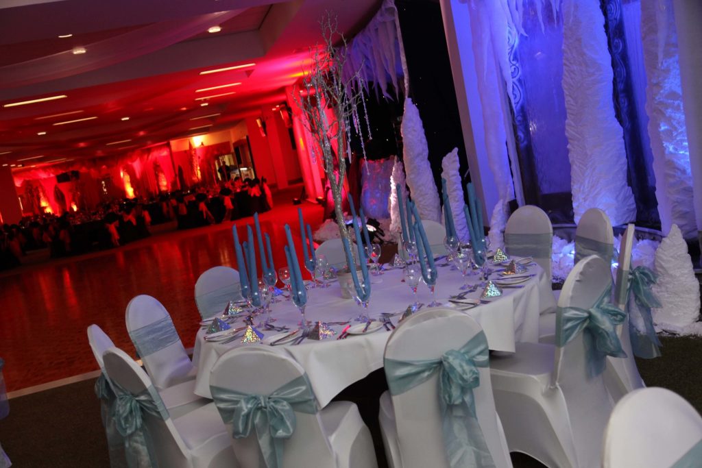 fire and ice themed gala dinner candle stick table centres blue chair sashes
