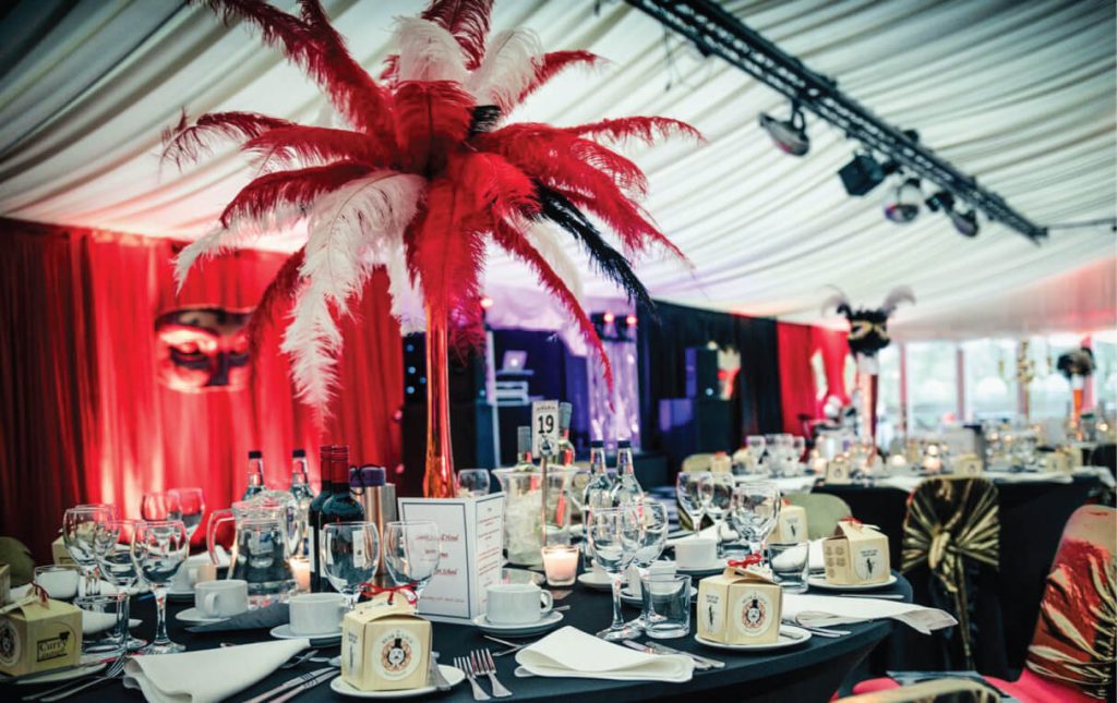 Red and white feather table centrepieces
