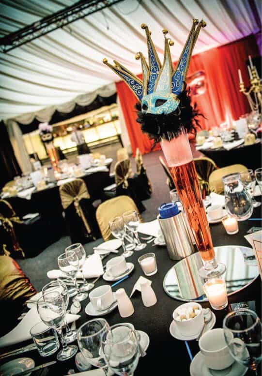 masquerade table centres with mirror bases. With black and gold colour scheme