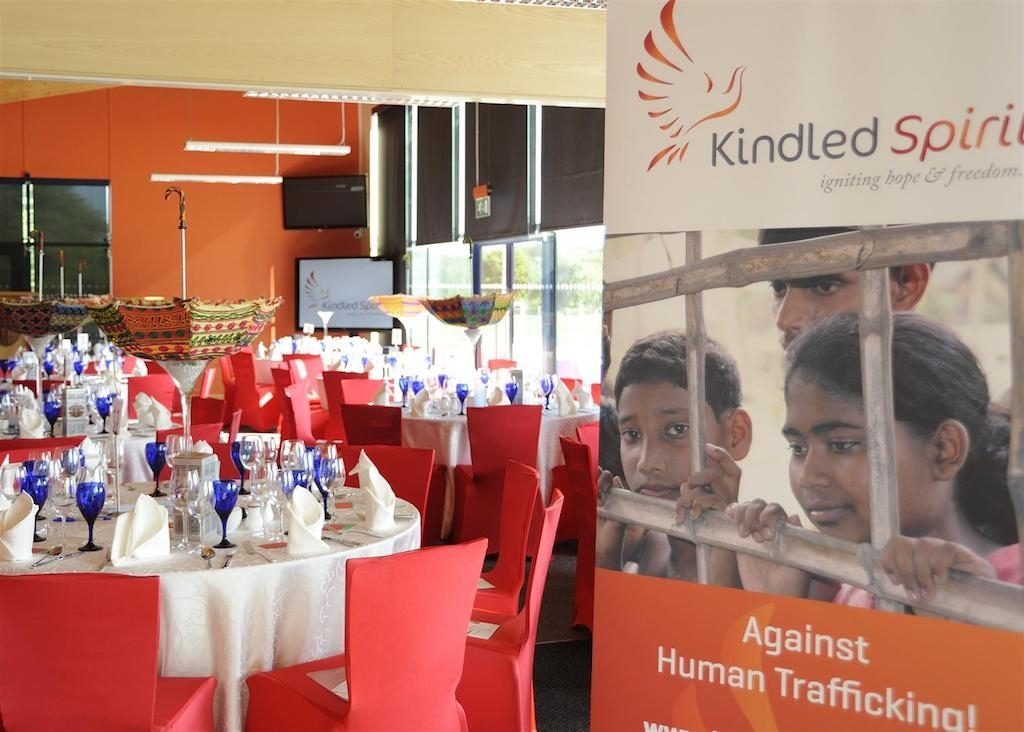 chair covers umbrella table centres Kindled Spirit Conference stand with red chairs and white tables umbrella table centres