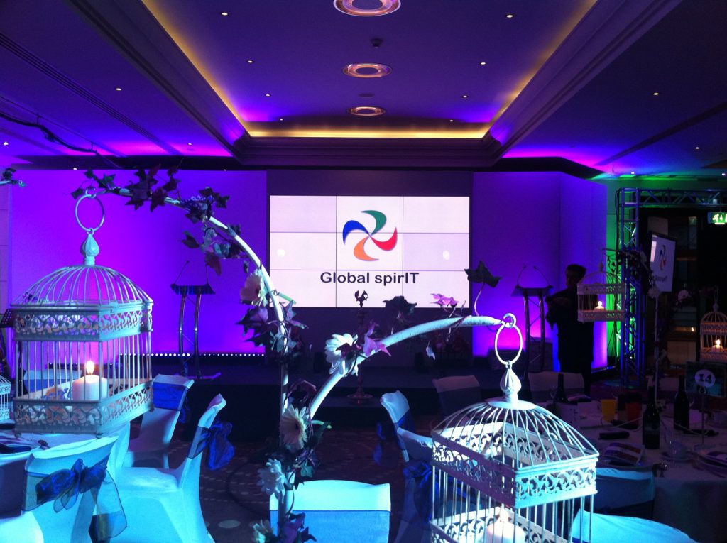 tree flower table centres with hanging bird cages candle lighting Global Spirit presentation screen with bird cage and candle table centres