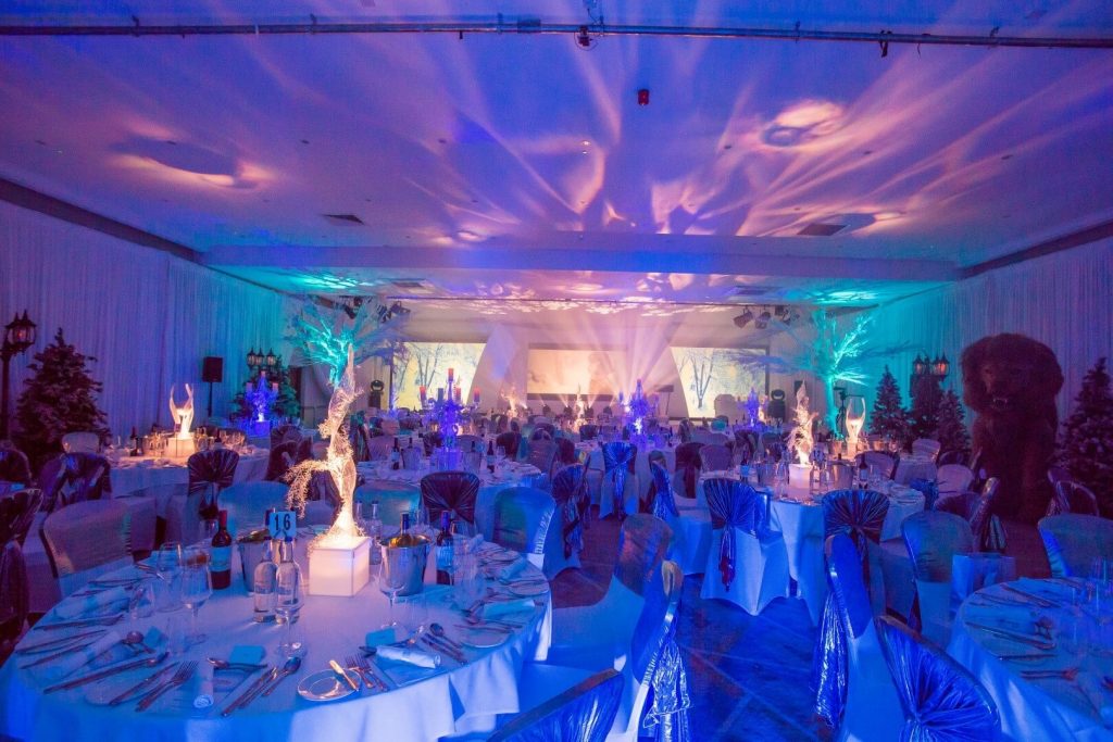 Blue Winter themed event room with Light Up LED Table centres