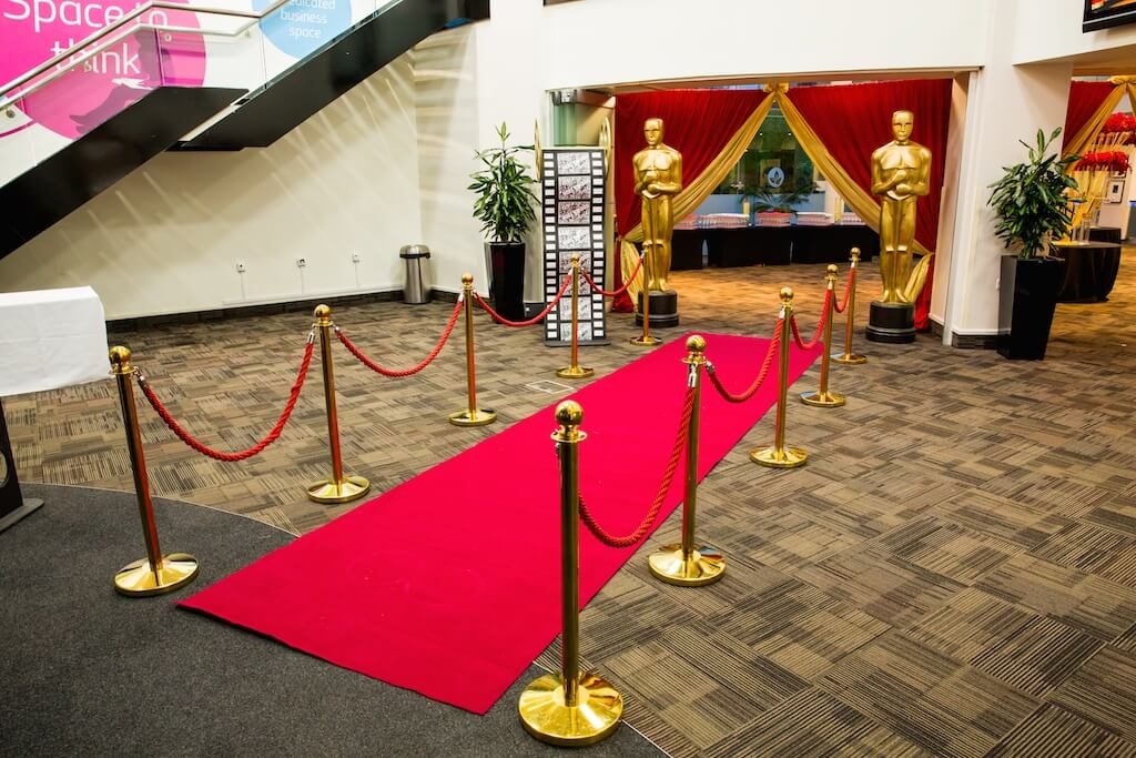 Red carpet walkway with Oscar award style statues