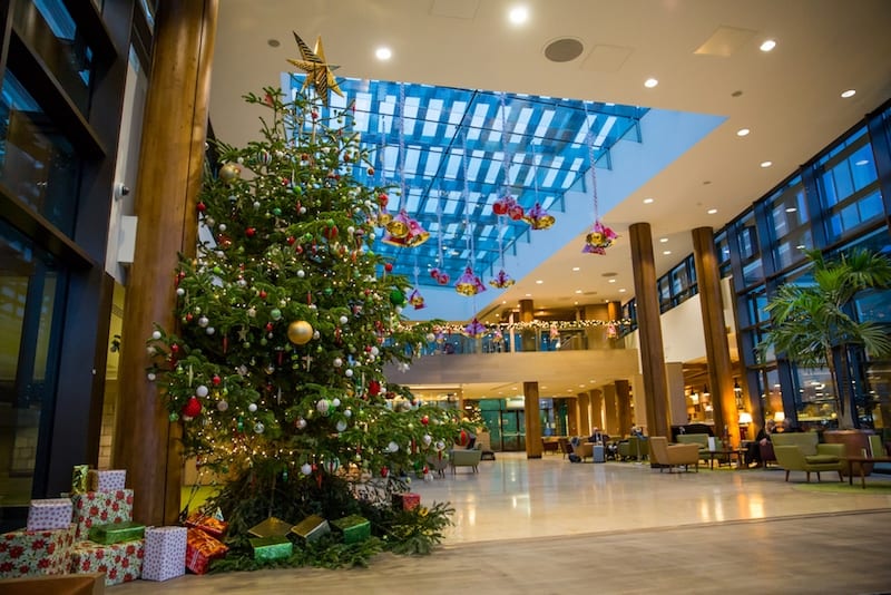 Large Christmas Tree with presents red green gold ceiling decorations