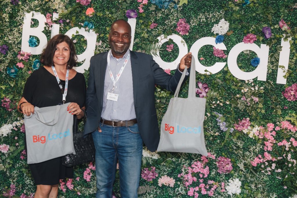 Big Local event with foliage floral walls backdrop for photo opportunities