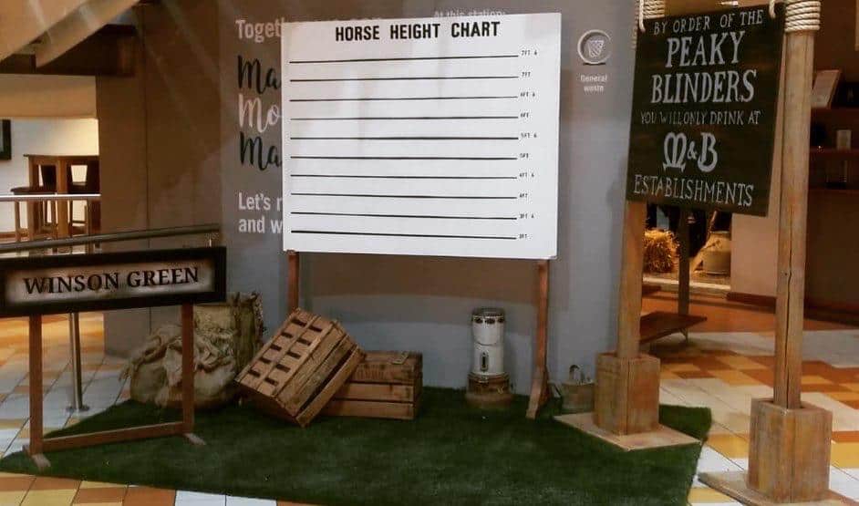 Peaky Blinders props with horse height chart and wooden boxes installation bucks