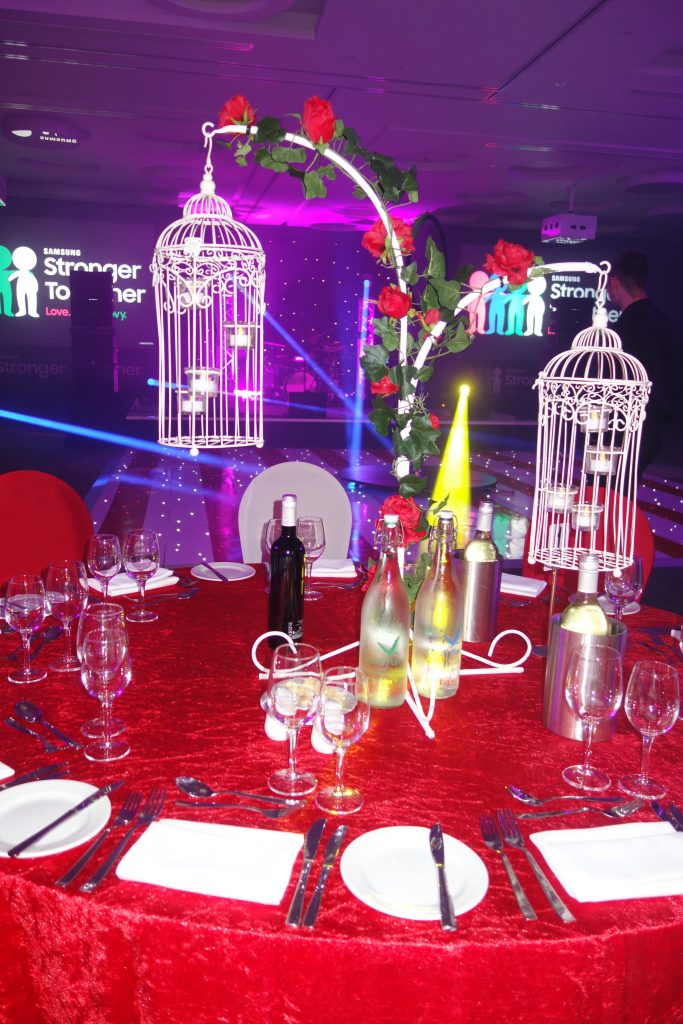 white bird cage table centres red roses floral flowers