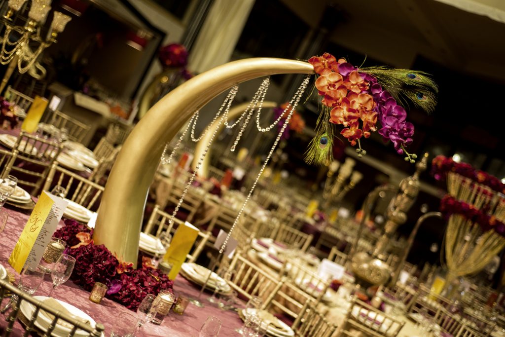 tall gold curved elephant tusk table centres jewel draping